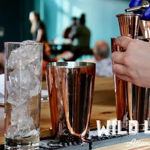 a bartender pouring a drink