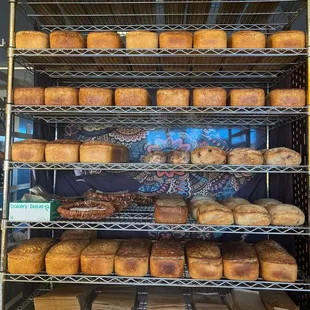 Our counter displaying our variety of our sourdough breads at our shop. Looking forward to seeing you soon!