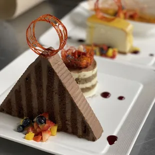 a chocolate cake with fruit on top