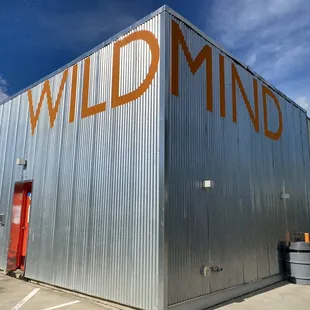 a building with the word wild mind painted on it