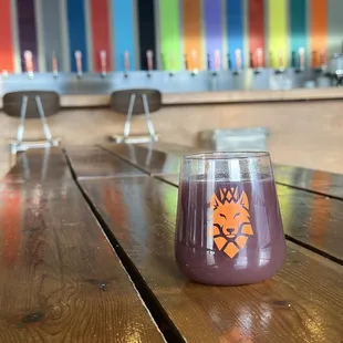 a glass on a wooden table