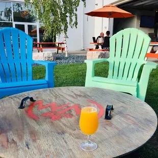 a table with a glass of orange juice