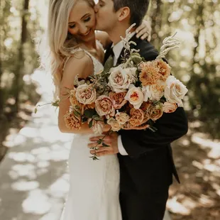 Book The Wild Mother for your wedding flowers. Their designs and customer service won't disappoint.