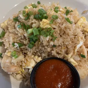 Signature fried rice with shrimp with side of sriracha sauce