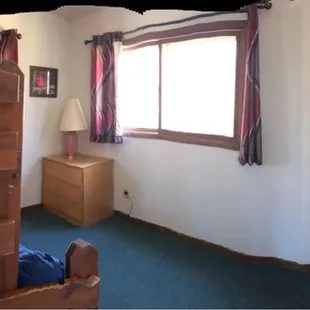 Cabin bedroom with bunk beds and extra cot