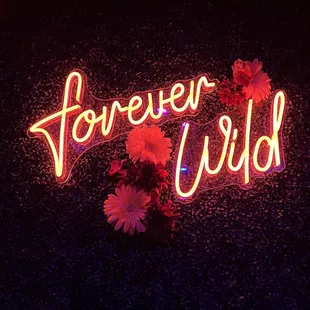 Neon signage by the restrooms