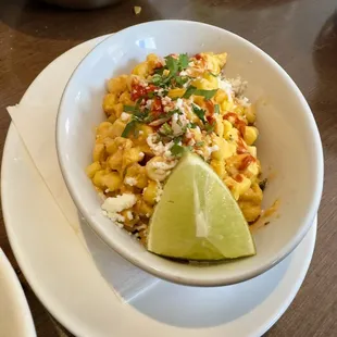 Street Style Corn - creamy sweet corn, sour cream, cotija, Tajin