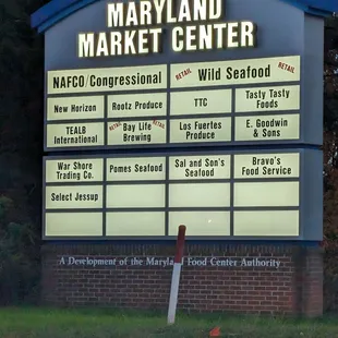 Sign for Maryland Market Place that includes Wild Seafood.