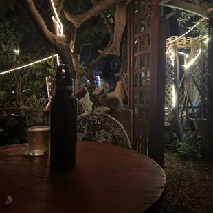 Back yard located downstairs from the bar pass another seating area. Very quiet with conversations of joy.