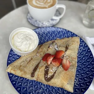Nutella crepe with strawberries, banana and whipped cream (on the side)