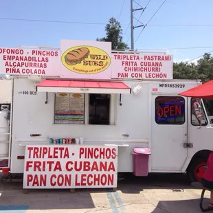 people sitting at picnic tables
