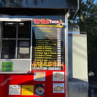 a food truck with a menu on the side