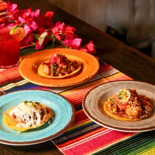 three plates of food on a table