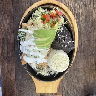 a bowl of rice, beans, and avocado