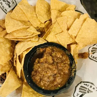 a bowl of chili and tortilla chips