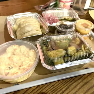 Sides that came in the platter - potato salad, marinated pickle spears, buns, and homemade sauces.