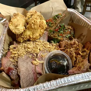 Family platter - fried chicken wings, sticky ribs Asian style, pulled pork, and super tender brisket.
