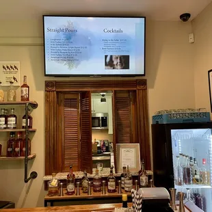 a bar with a television above it