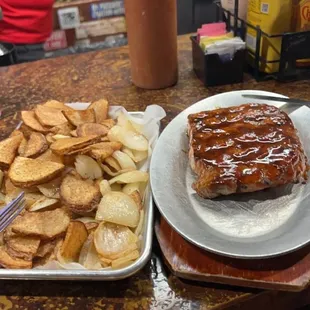 Hog slab with taters and onions.