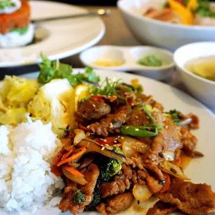 Spicy Pork Toshi: Korean style marinade tender pork with sweet and spicy Korean house style sauce. Served with miso soup ($13 for lunch).