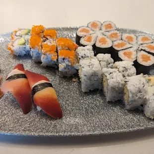 Sushi goodness - California roll, shrimp tempura, salmon rolls, and surf clam nigiri