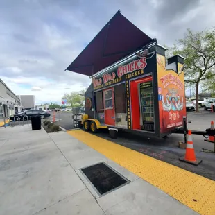 a food truck parked on the side of the road