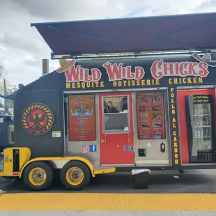 a food truck parked in front of a restaurant