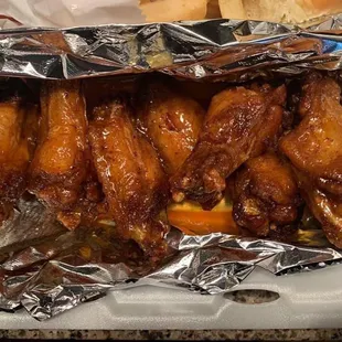chicken wings wrapped in tin foil