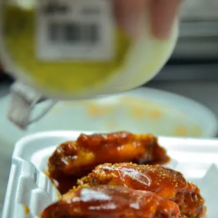 bbq wings with lemon pepper on top