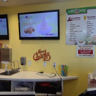 a counter and tvs in a restaurant