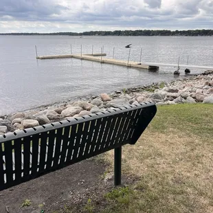 Bench in park with dock near playground