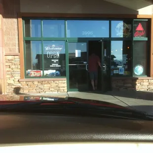 a woman entering a store