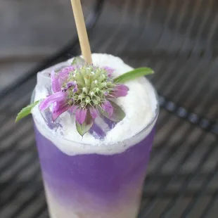 a purple and white drink on a table