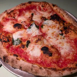 Margherita - tomatoes, fior di latte, garlic, basil, EVOO, pecorino