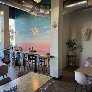 a dining room with tables and chairs