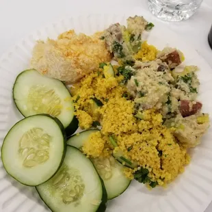 a plate of rice and cucumbers