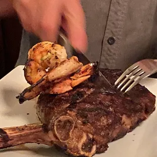 T-bone steak with two prawns