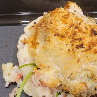 Crab stuffed rockfish over mashed potatoes and spinach.
