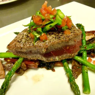 Sashimi grade Peppercorn Crusted Ahi dish with Carpinito Farms chard, sautéed Ostrom&apos;s shiitake e mushrooms and fresh asparagus.