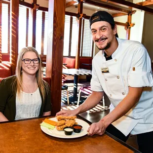 a man and a woman in a restaurant