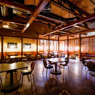 a dining room with tables and chairs