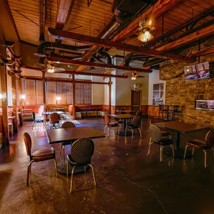 a dining area with tables and chairs