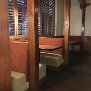 Dining area with TV and fireplace and booths