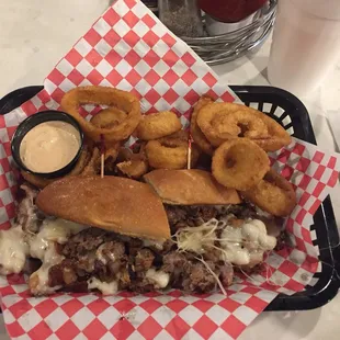 Philly cheese steak grilled to perfection. With a side of onion rings and wild sauce