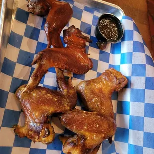 Daytona style wings with two different spicy sauce and a side of pineapple teriyaki sauce.