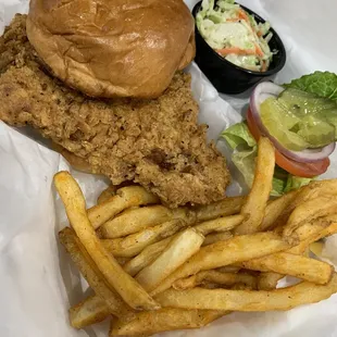 Hand breaded pork tenderloin with fries and coleslaw. $10.50. Delicious.