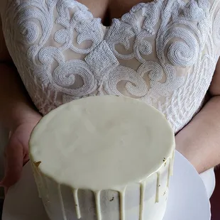 a woman holding a cake