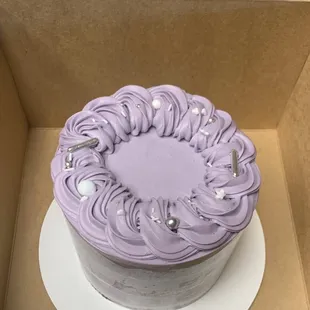 a purple cake in a box