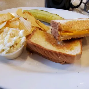 Close up!   Grilled cheese complementary chips, Coleslaw and a pickle.  12/9/2021