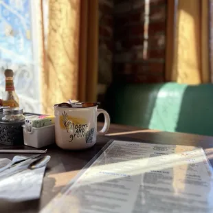 They use cute thrifted mugs -- both to serve drinks and to dispense the creamers at the table.